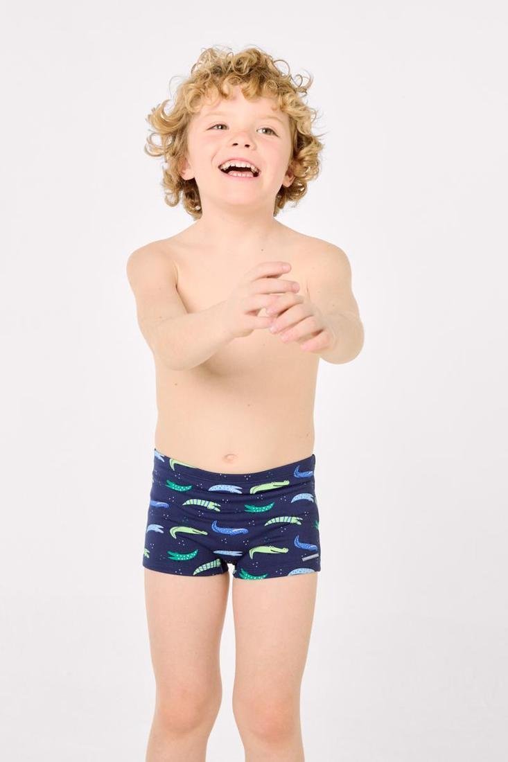 Costume da bagno aderente in stile boxer con stampa coccodrillo. Il tessuto elasticizzato si adatta perfettamente al corpo e consente totale libertà di movimento durante il nuoto.