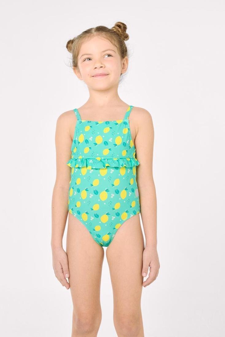 Costume da bagno bimba YSABEL MORA con una stampa allegra a limoni. Include un balza sul petto e una schiena scoperta con chiusura a laccio.