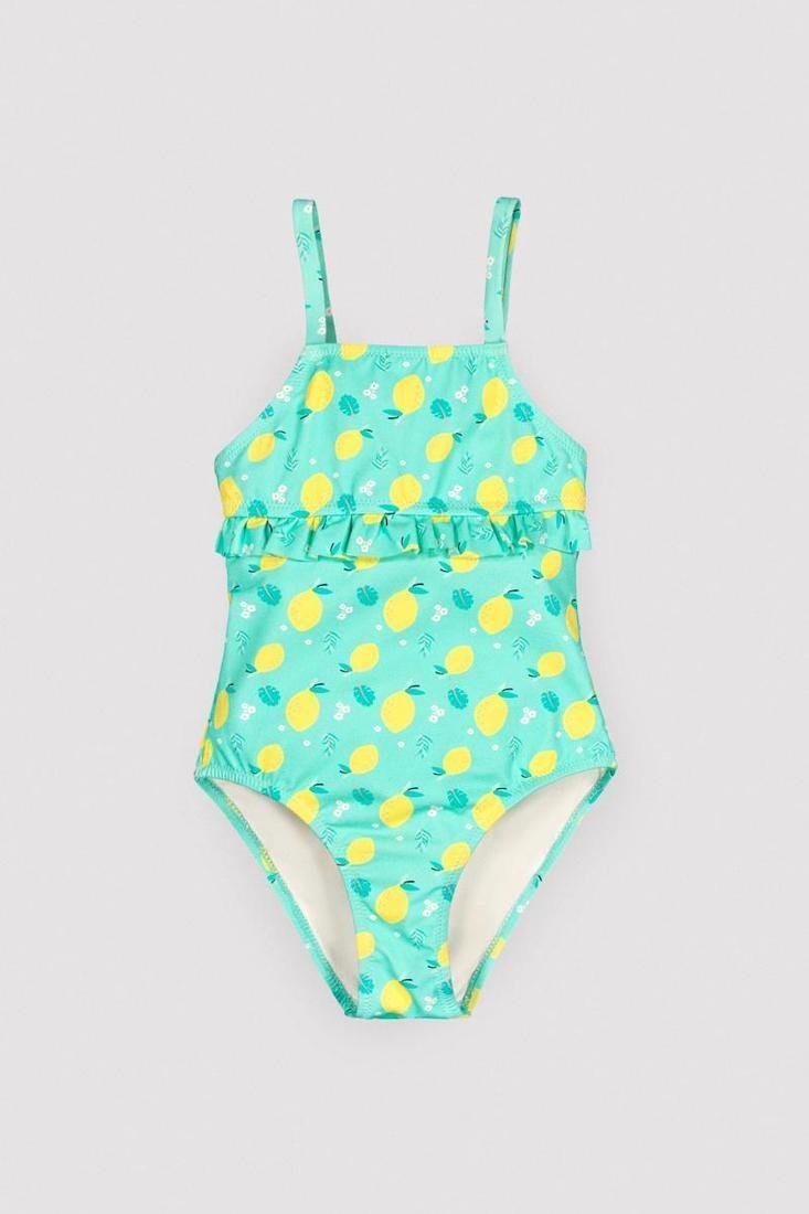 Costume da bagno bimba YSABEL MORA con una stampa allegra a limoni. Include un balza sul petto e una schiena scoperta con chiusura a laccio.